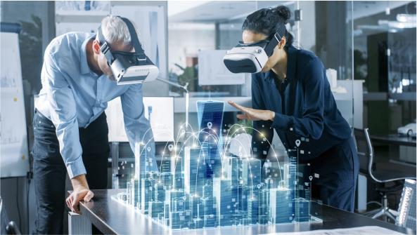 dos personas trabajando usando gafas de realidad virtual